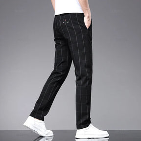 Calça Social Xadrez Masculina Montelezzi ML204, com modelagem slim fit, padrão xadrez clássico e tecido confortável, perfeita para looks formais e profissionais.